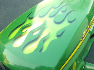 Lawn mower racing flames on John Deere