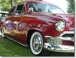 Fiesta Wheel Cover Hubcaps on a Vintage Red Chevy