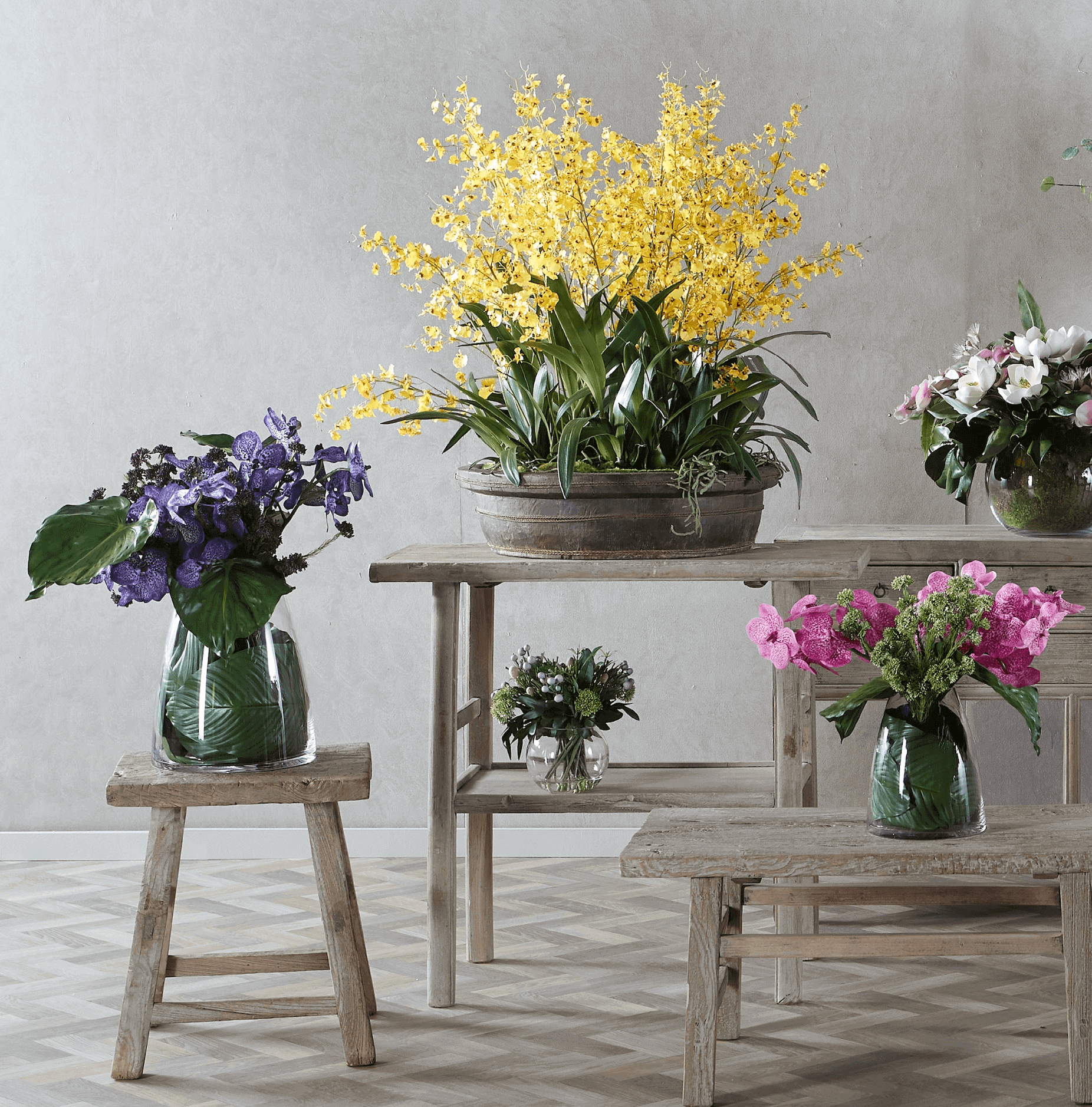 artificial flower arrangements on tables