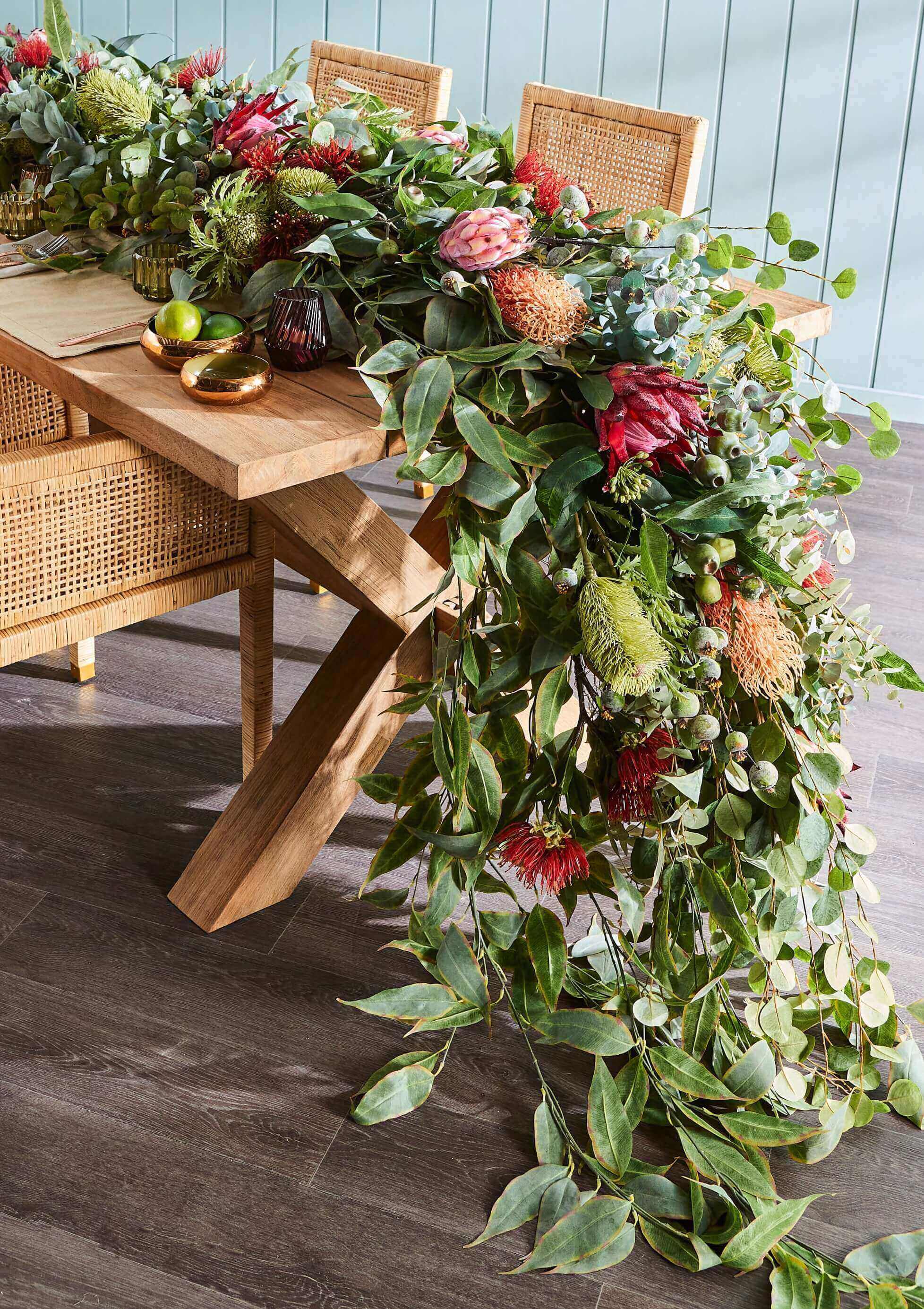 mixed greenery and artificial flowers placed on a table
