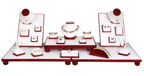 35 piece Showcase Jewelry Display Set with Rosewood trim and white faux leather.